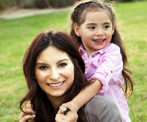 Woman with girl on her back