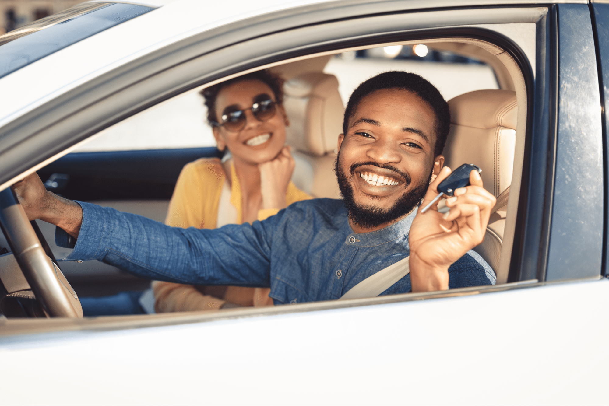 African-American Couple Smiling in Car